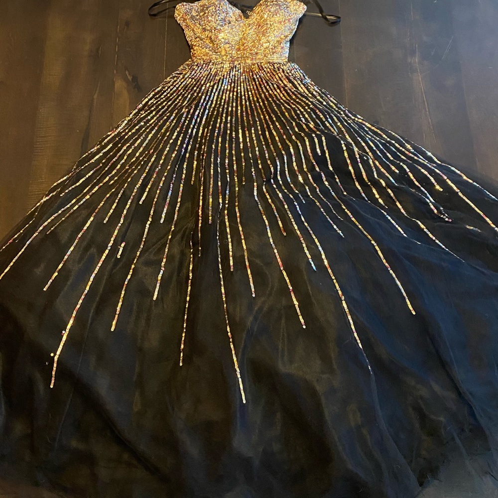Worn to a symphony ball once, has been in the dry cleaning bag ever since.